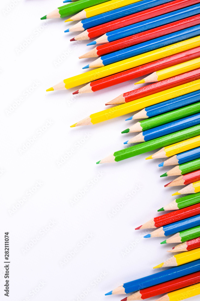 Many different colored pencils on a white background with a place for text and cory space . Many different colored pencils on a white background with a place for text and cory space .