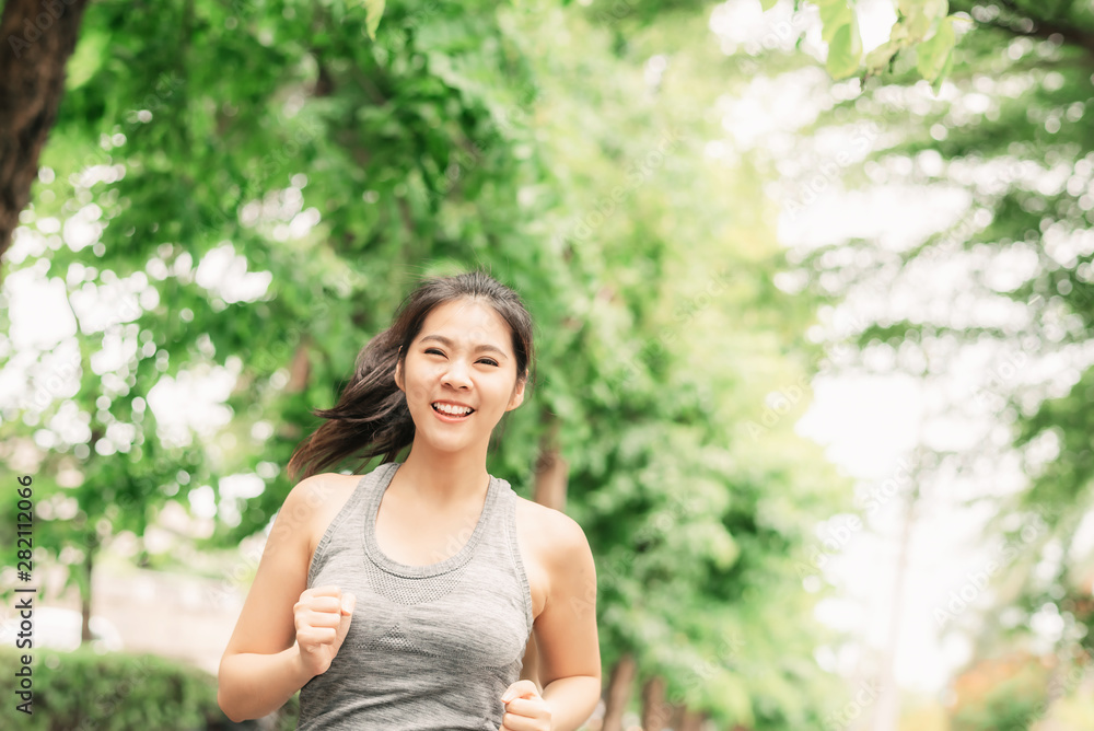 woman runner running outdoor in a park for health woman runner running outdoor in a park for health