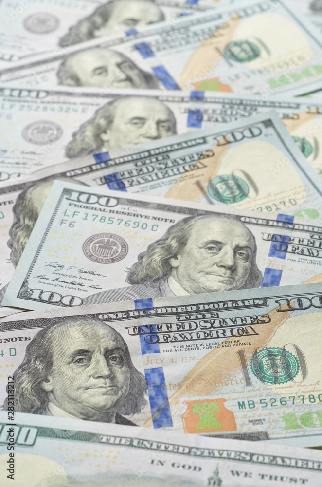 Background from chaotically lying of notes for one hundred dollars. Background from chaotically lying of notes for one hundred dollars.
