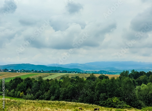 Carpathian hills during the rain with dramatic clouds
