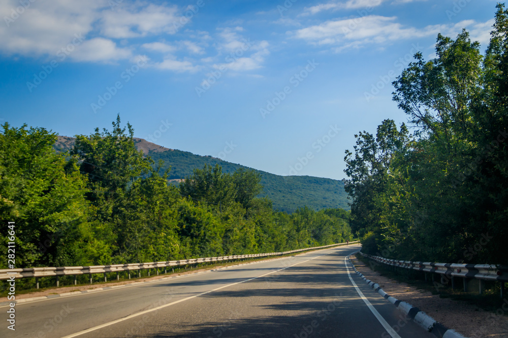 Russian asphalt roads. Background road. Roads in the mountains of Crimea. Travel by car. Road views. Russian asphalt roads. Background road. Roads in the mountains of Crimea. Travel by car. Road views.