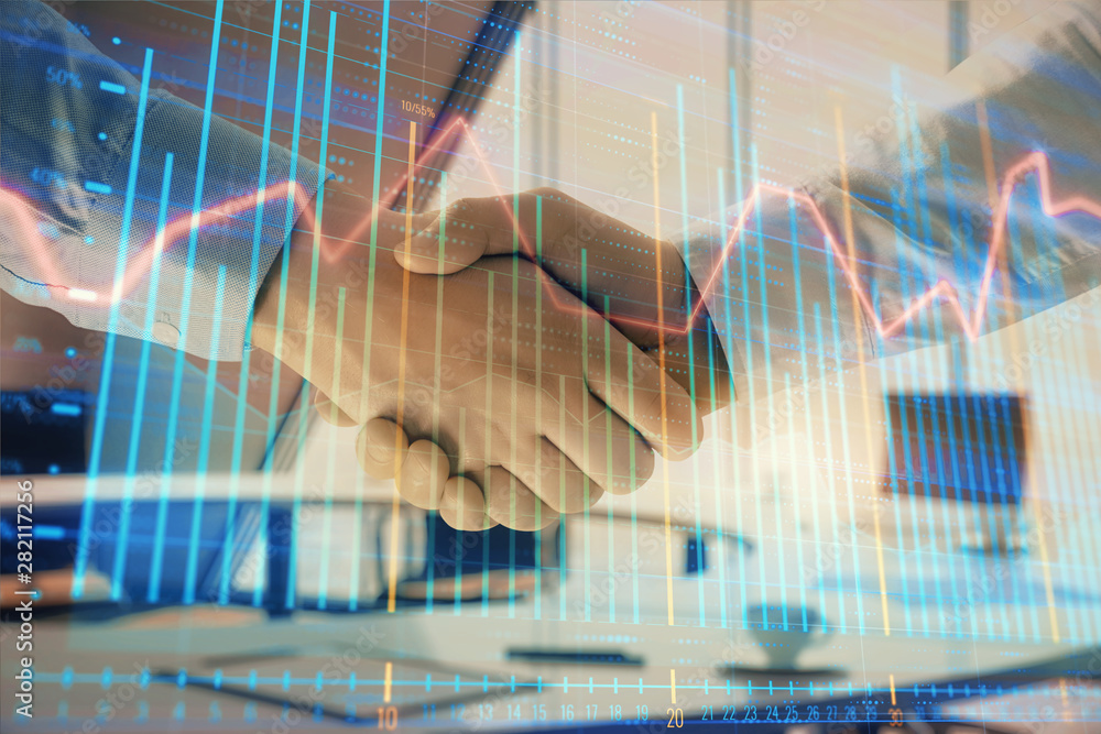Multi exposure of financial graph on office background with two businessmen handshake. Concept of success in business Multi exposure of financial graph on office background with two businessmen handshake. Concept of success in business