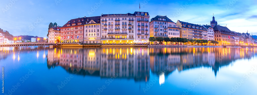 Lucerne. Panorama. Old city embankment and medieval houses at dawn.