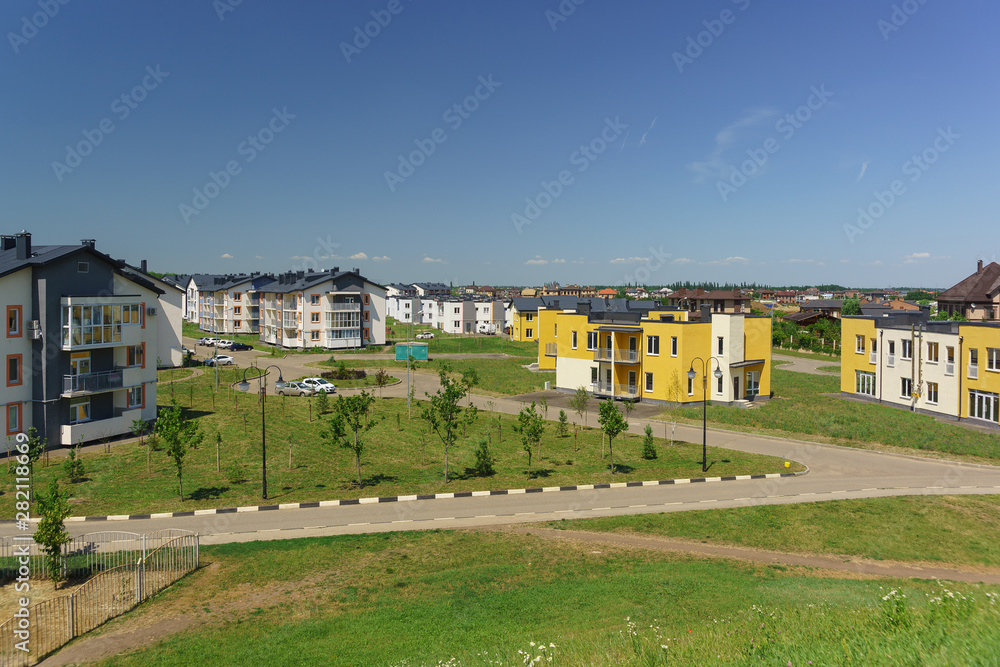 Low-rise apartment buildings in the new district of Krasnodar on the streets of Schumann and Wagner on a Sunny day