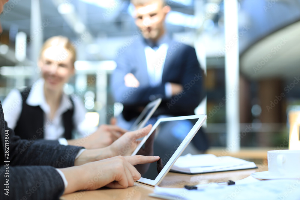 Image of human hand pointing at touchscreen in working environment at meeting. Image of human hand pointing at touchscreen in working environment at meeting.