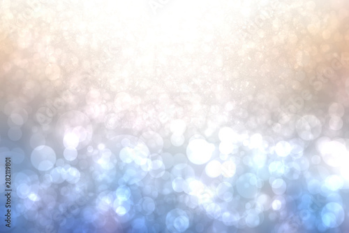 Festive light brown blue silver bright abstract bokeh background with white circles. Template for your design. Beautiful texture.