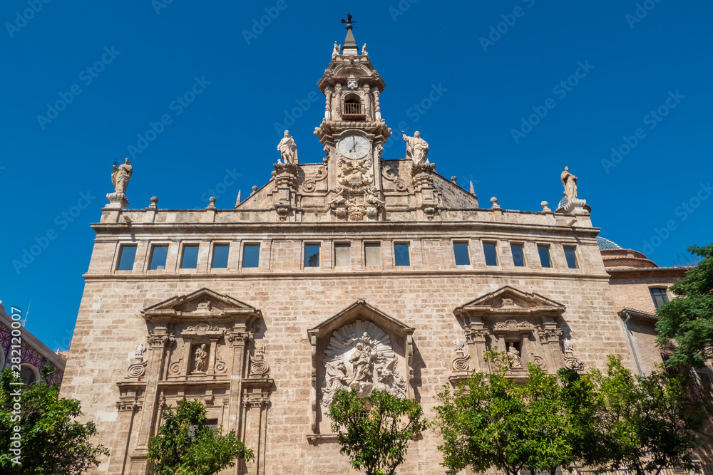 Obraz premium Santos Juanes church (San Juan del Mercado) adjacent to Vaelncia's Central Market and facing the Llotja de la Seda building.Valencia, Spain.