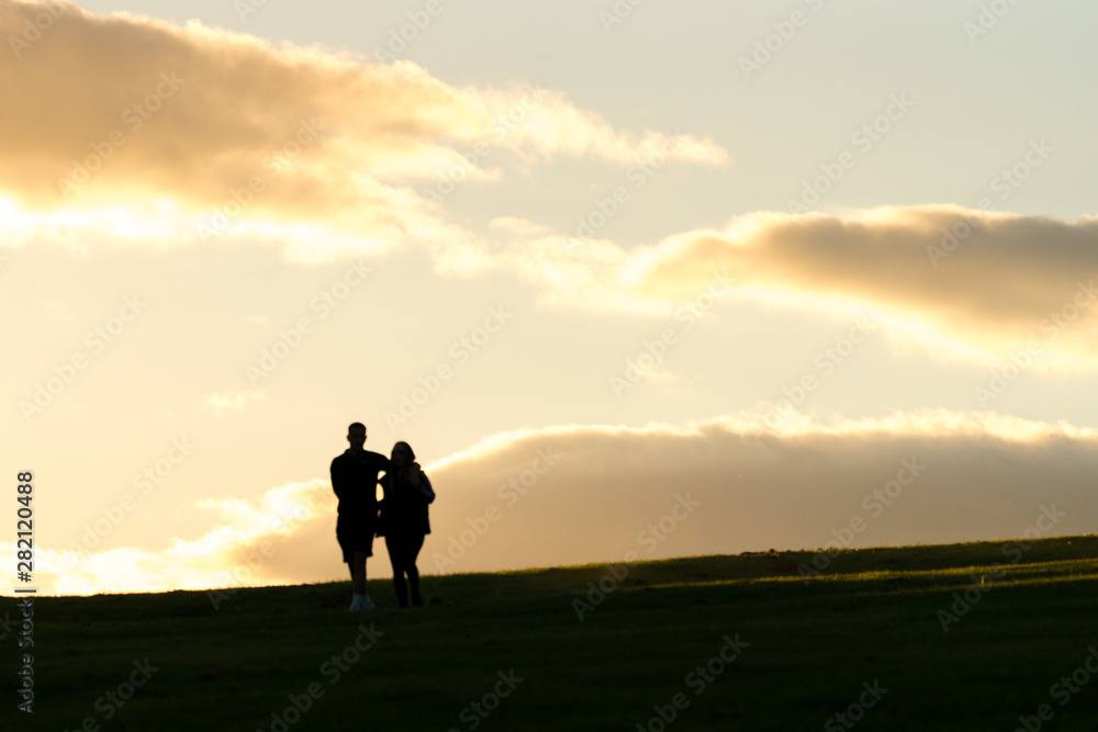 shadow persons walking with sky background shadow persons walking with sky background