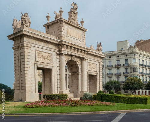 Puerta del Mar tirumphal arch at the end of Colon Street, the main commercial thoroughway of Valencia, Spain