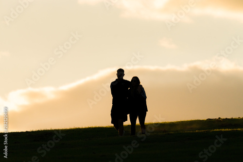 shadow persons walking with sky background 