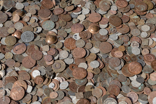 Old vintage fake coins background for sale to tourists in the Indian market on the street in Rishikesh  India. Close up