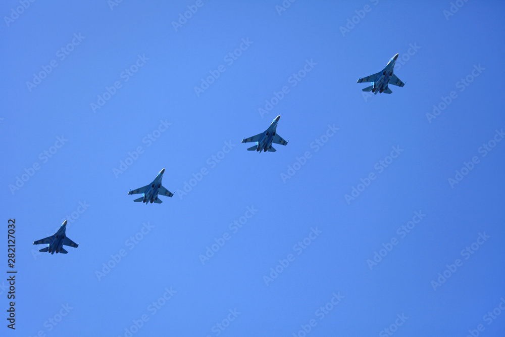 Kyiv, Ukraine - August 24, 2018: Warplanes (supersonic heavy fighter Su-27) in the sky during the military technique parade in Kiev. Independence day celebration. Military equipment Kyiv, Ukraine - August 24, 2018: Warplanes (supersonic heavy fighter Su-27) in the sky during the military technique parade in Kiev. Independence day celebration. Military equipment