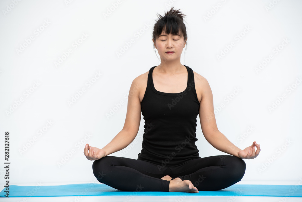 Yoga Asian woman doing exercise on white background.