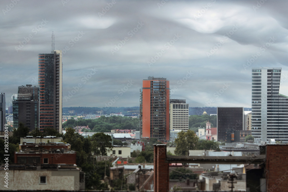 City landscape before thunderstorm with gray clouds