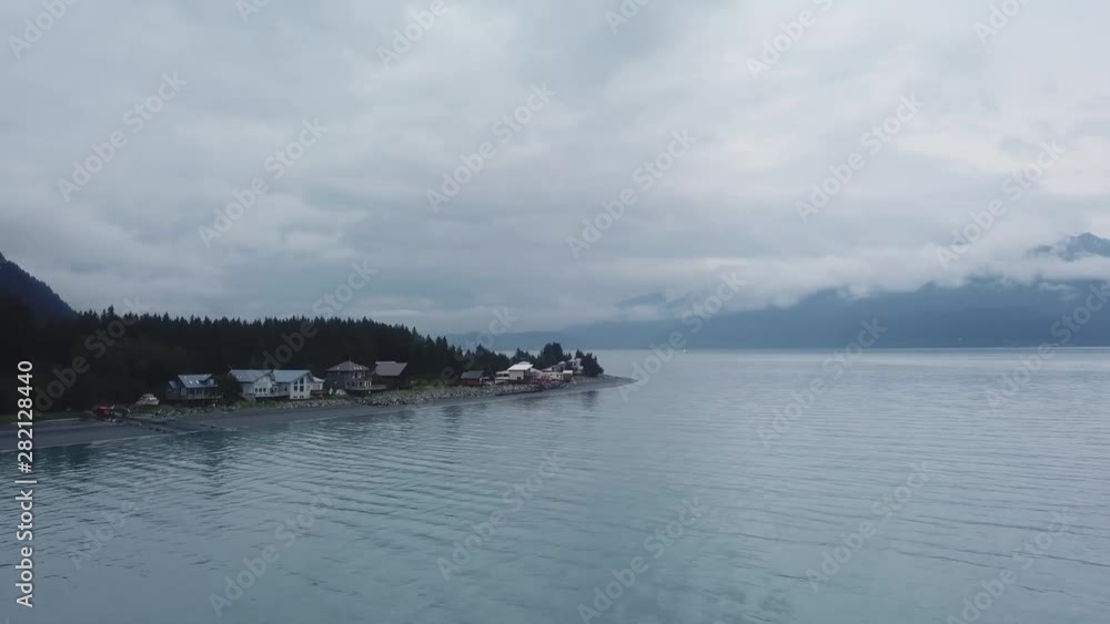 Aerial View of Houses on Lake With Mountains in Background in Alaska on Cloudy Day.mp4 Aerial View of Houses on Lake With Mountains in Background in Alaska on Cloudy Day.mp4