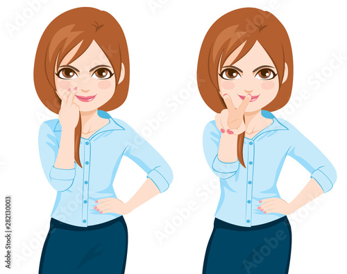 Young businesswoman making watching you motion gesture pointing fingers at eye and towards front