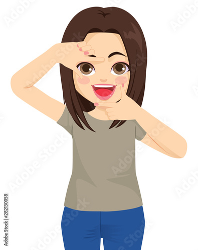 Young brunette woman happy making framing gesture with both hands