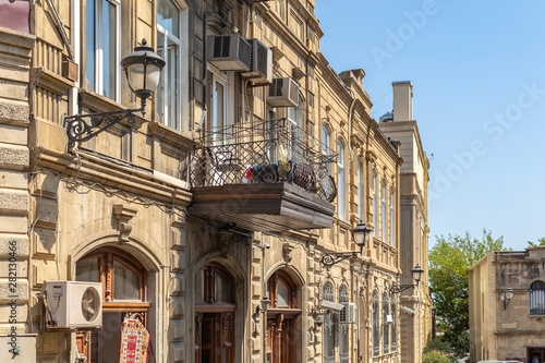 Rustic facade of an old house with a balcony
