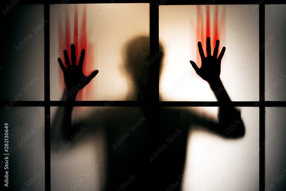 Foto Stock Silhouette Scared Man With Red Bloody Hand Stand Behind Glass Door Horror