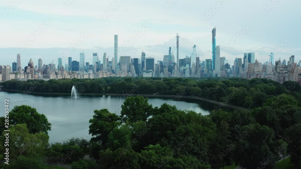 View on Central Park, buildings and skyscrapers from air. Aerial cityscape view of Manhattan from a drone. View on Central Park, buildings and skyscrapers from air. Aerial cityscape view of Manhattan from a drone.