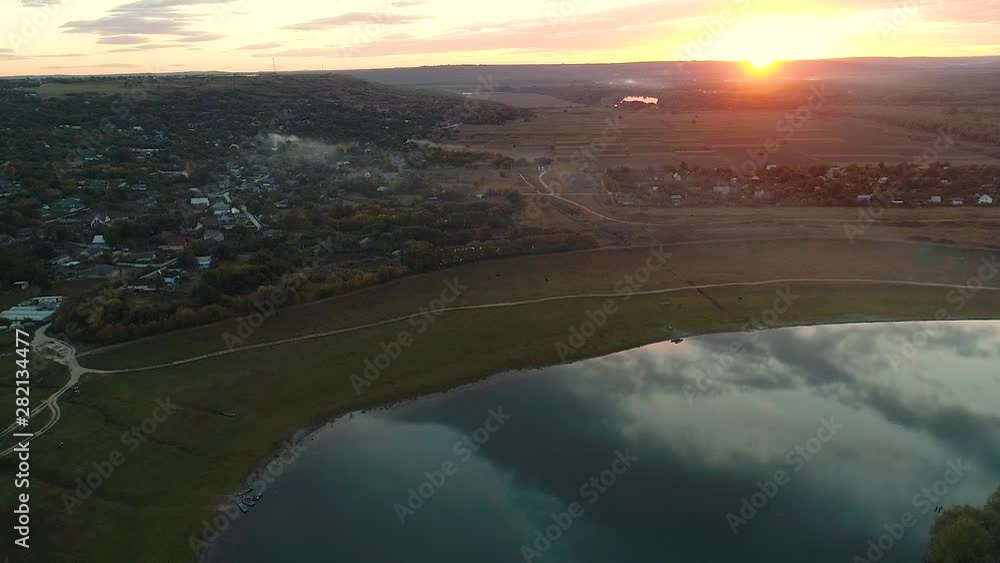 Aerial view of a river curve and a moldavian village, during sunset. Aerial view of a river curve and a moldavian village, during sunset.