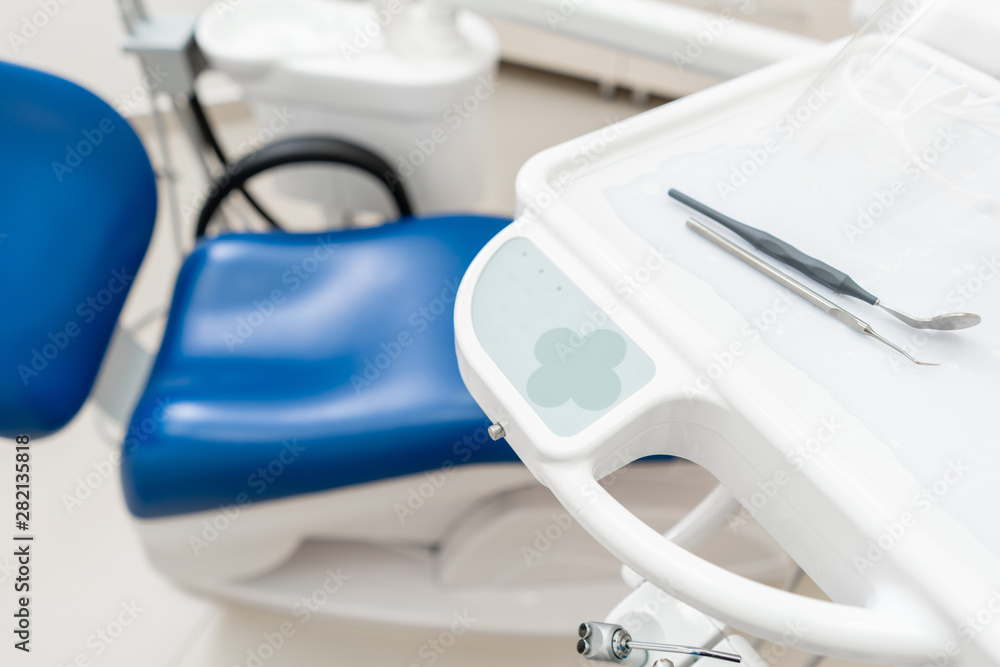 dental chair control buttons. Dental work in clinic. Operation, tooth replacement. Medicine, health, stomatology concept. Office where dentist conducts inspection and concludes. dental chair control buttons. Dental work in clinic. Operation, tooth replacement. Medicine, health, stomatology concept. Office where dentist conducts inspection and concludes.
