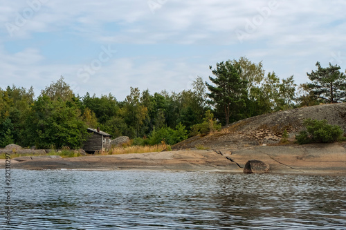 Ranki Island Finland. Seascape of Northern Europpa, rocky coast, forest and blue sky. photo