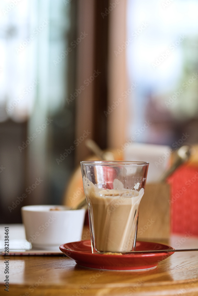 Large cup of coffee latte on a table Large cup of coffee latte on a table