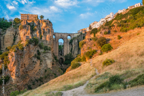 Ronda and its historic bridge in the late afternoon sun. Province of Malaga, Andalusia, Spain. photo