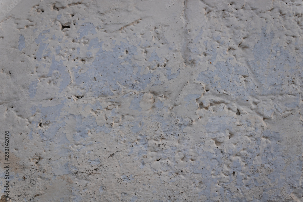 old dirty concrete wall worn out by time and weather painted white old dirty concrete wall worn out by time and weather painted white