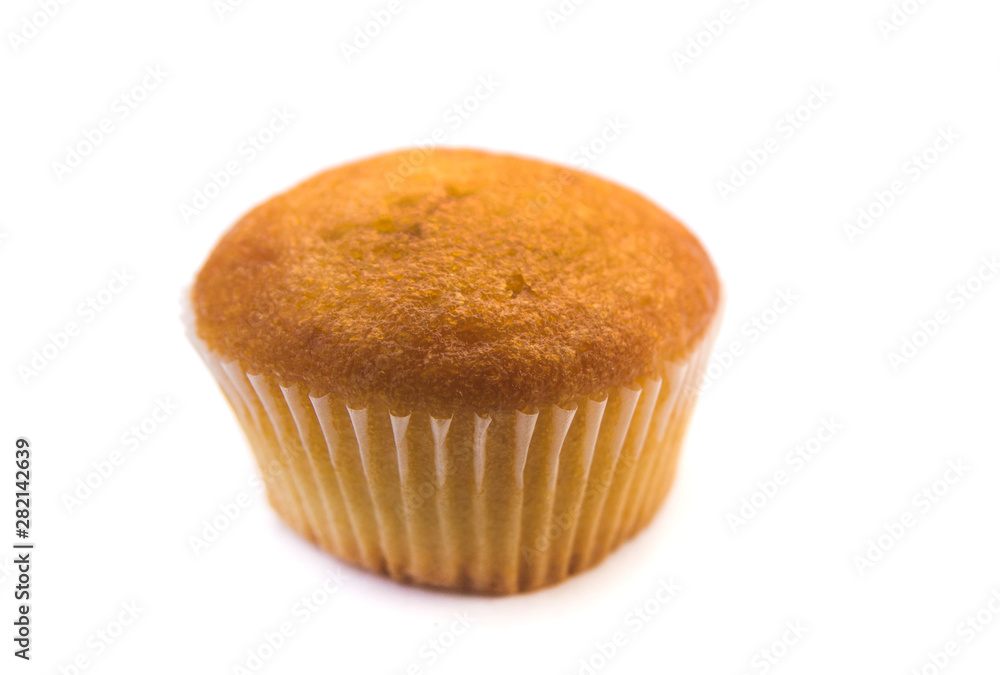 a plain cupcake or madeleine on a white background. a plain cupcake or madeleine on a white background.
