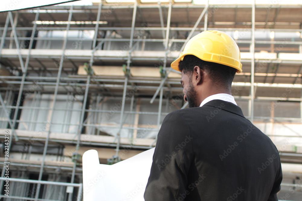 Construction worker and architect outside