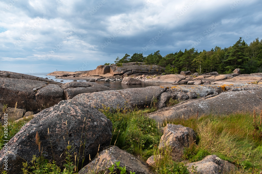 Big stones, rocky coast of Rankki island. Finland in the Baltic Sea. Seascape nature of northern Europe Big stones, rocky coast of Rankki island. Finland in the Baltic Sea. Seascape nature of northern Europe