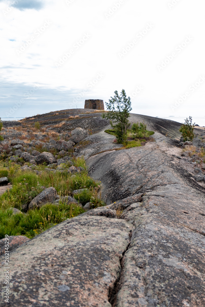 Rocky island in the Baltic Sea, Finland. Landscape with huge stones and cracks in the granite massif. The environmentally friendly nature of Northern Europa Scandinavia.