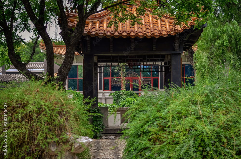 Old pagoda in cozy chinese garden.