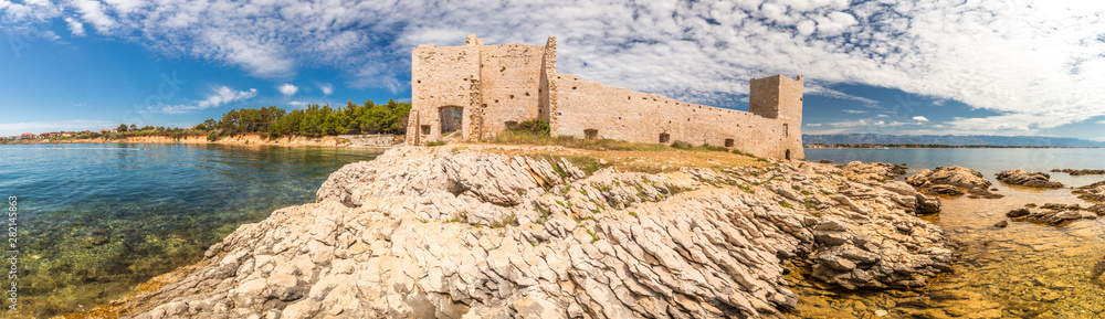 Panorama view of Kastelina castle, fortress ruins on Vir island, Croatia, Europe.