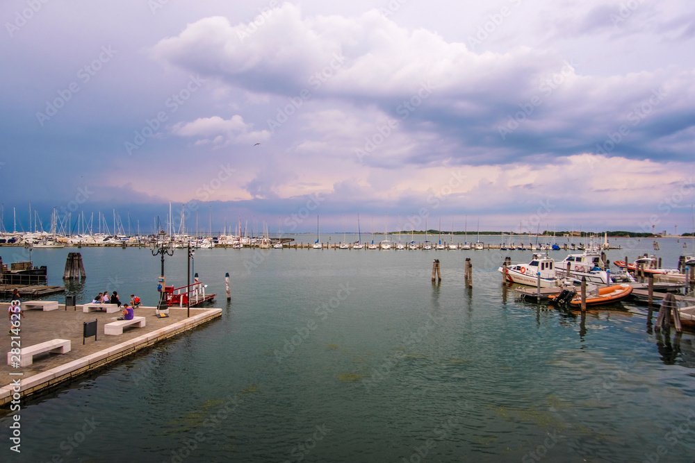Sottomarina, Italy - July, 07, 2019: cityscape with the image of channel in Sottomarina, Italy, the small town near Venice