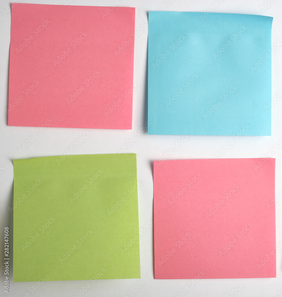 pink, blue, green paper stickers pasted on white background pink, blue, green paper stickers pasted on white background