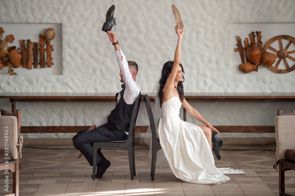 Funny wedding couple having fun at restaurant Stock Photo | Adobe Stock