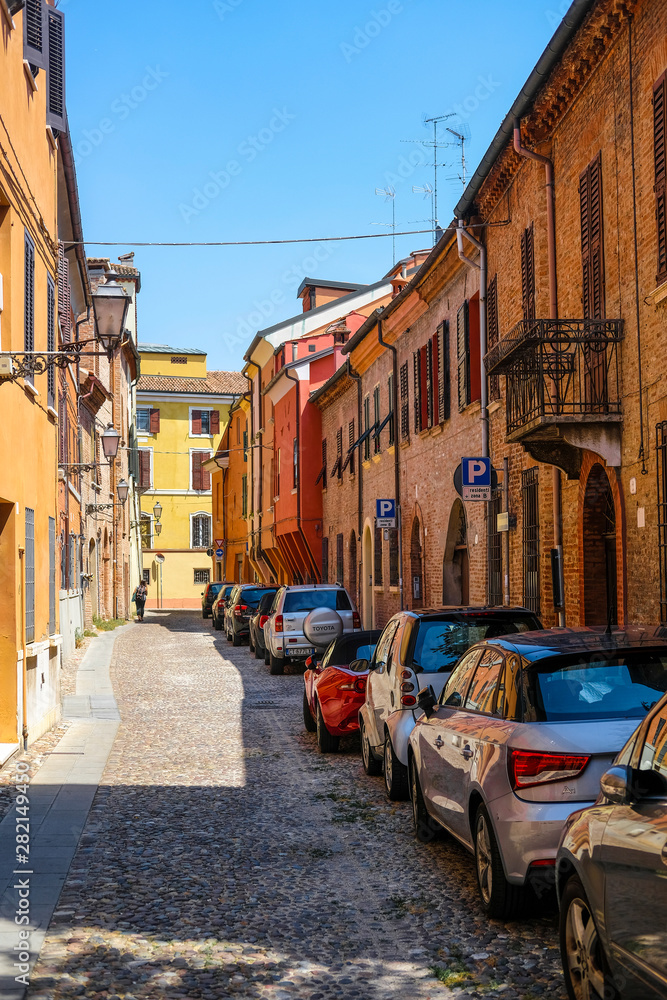 Ferrara, Italy - July, 11, 2019: cars on a parking in a center of Ferrara, Italy