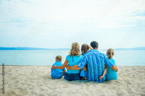 happy family at sea in greece on nature background