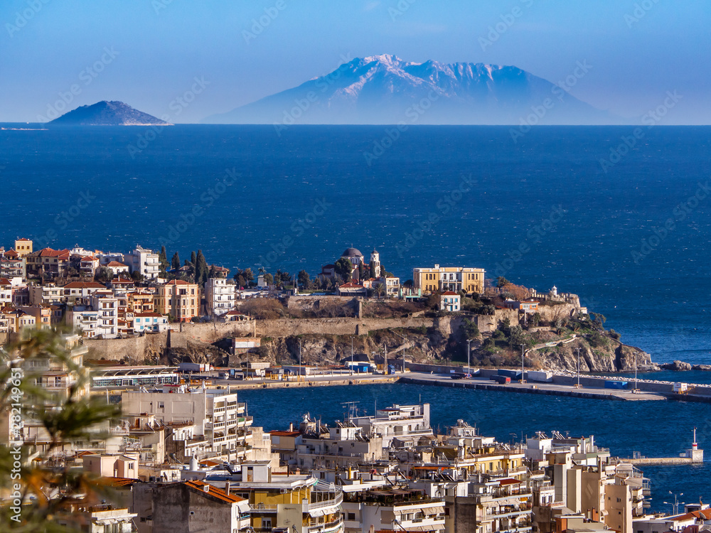 Port and the old town of Kavala city and small islands in the background