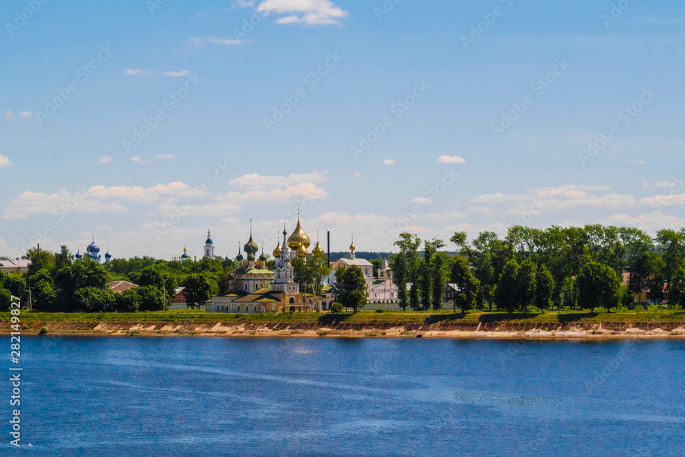 Uglich, Russia - June, 17, 2019: embankment of Volga river in Uglich, Russia with a view to .Resurrection monastery