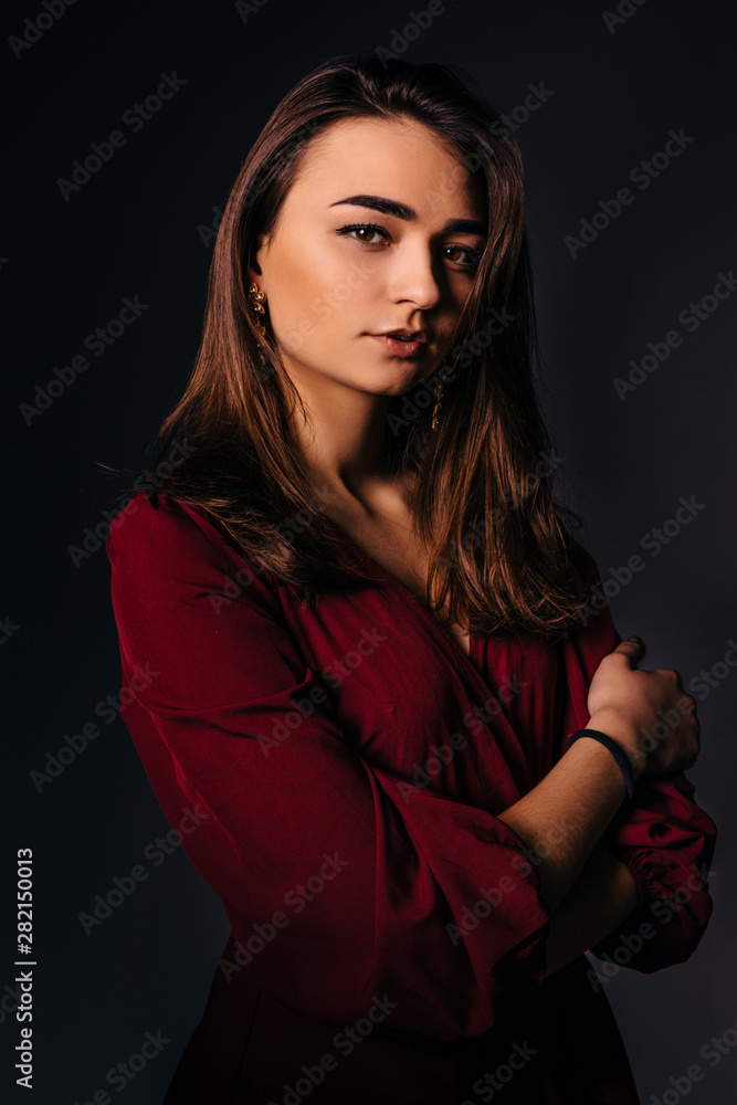 Studio photo. Young beautiful woman in dress. Trendy make up. Studio photo. Young beautiful woman in dress. Trendy make up.