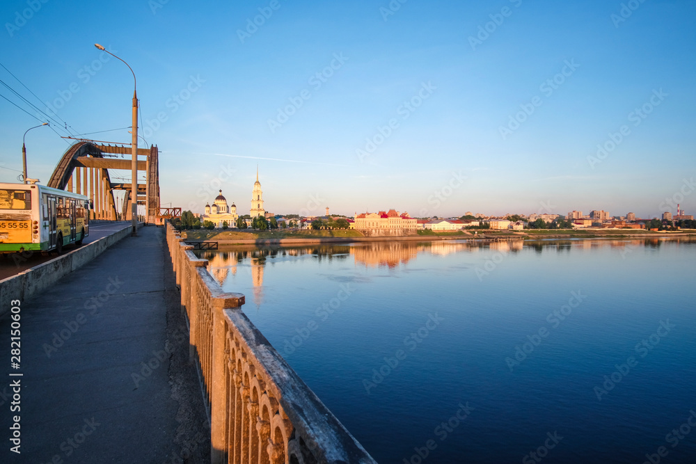 Rybinsk, Russia - June, 10, 2019: landscape with the image of Volga embankment in Rybinsk, Russia at sunrise. View from the bridge over Volga