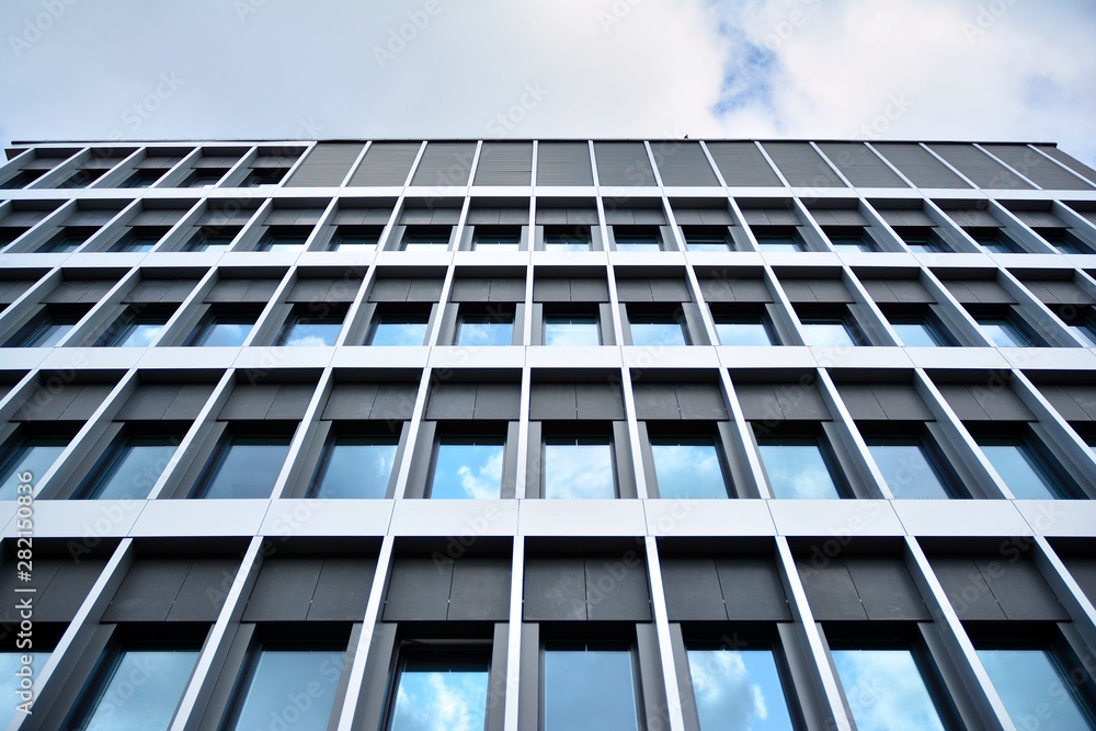 modern building with blue sky and clouds modern building with blue sky and clouds