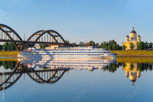 Rybinsk, Russia - June, 10, 2019: landscape with the image of a passenger ship on the Volga River, in the city of Rybinsk, Russia