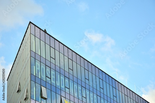 modern building with blue sky and clouds