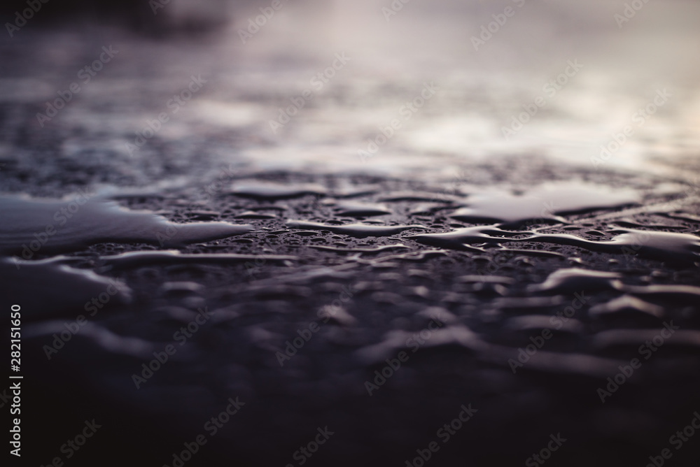 Water drops after the rain on the stone surface. Close up. Water drops after the rain on the stone surface. Close up.