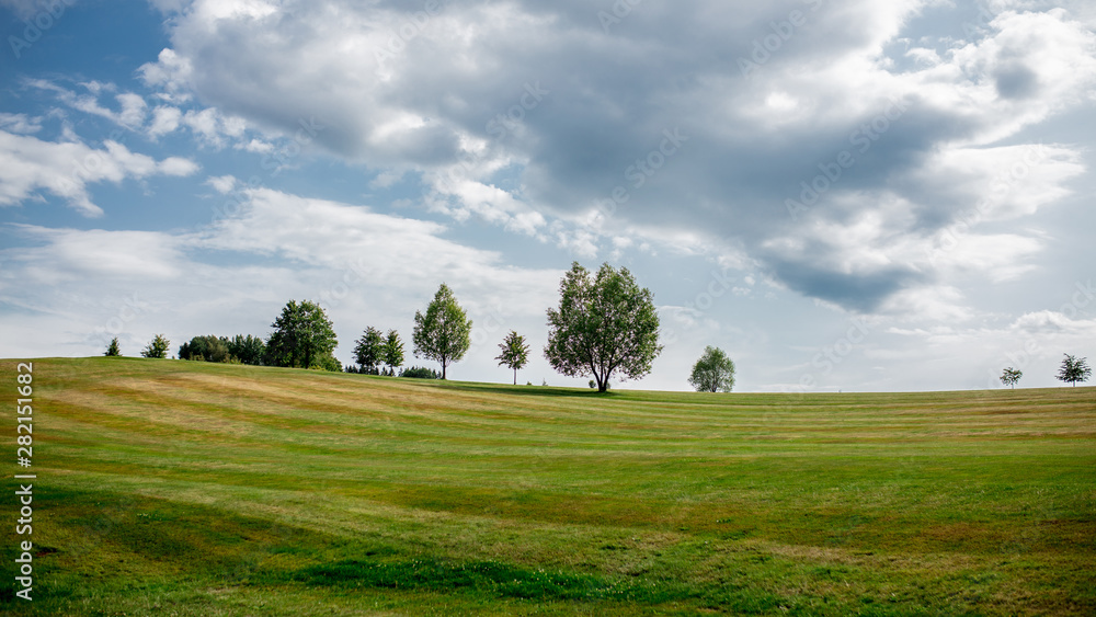 golf field with trees and lawn in Czech